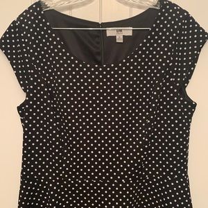 Black fit and flare dress with white polka dots